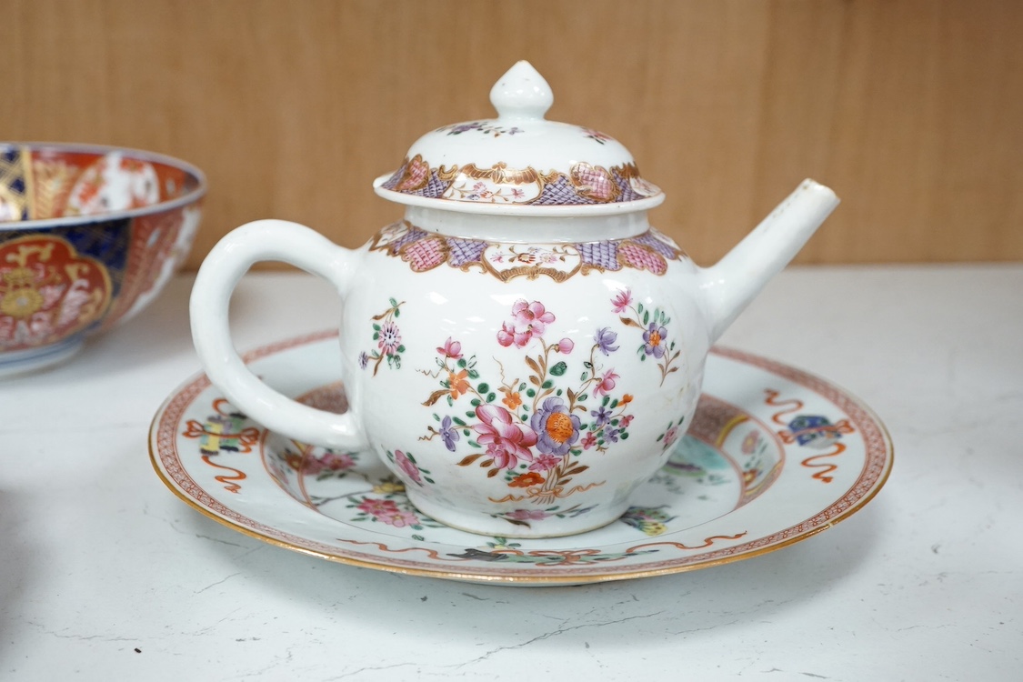 A Chinese export famille rose plate, Yongzheng period, an 18th century Chinese famille rose teapot and, together with two Japanese Imari pieces, largest 27cm in diameter. Condition - fair/good